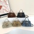 2024 new solid color truck buckle handbag French simple retro shoulder mesengers bag female one piece