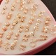 The new Korean version of the small and exquisite peach heart anti -allergic pearl earrings 2 yuan store thermal selling jewelry 36 -to -one box