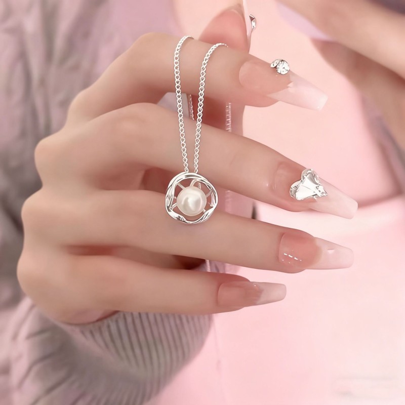 Pure silver 999 French retro freshwater pearl necklace women's light luxury niche high-end pendant autumn and winter necklace wholesale